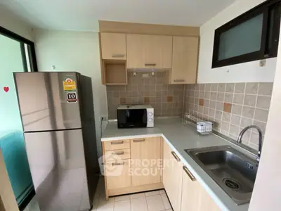 Modern kitchen with sleek cabinetry and stainless steel appliances