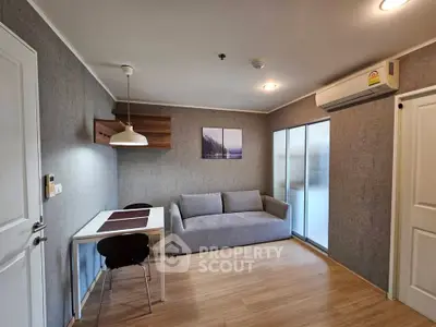 Modern living room with cozy sofa and dining area in stylish apartment