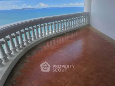 Stunning ocean view from spacious balcony with elegant balustrade, perfect for relaxation and enjoying sunsets.
