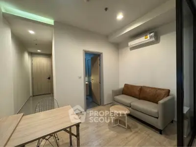 Modern living room with sleek furniture and air conditioning in a stylish apartment.