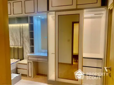 Luxurious bedroom with elegant built-in wardrobe and vanity area