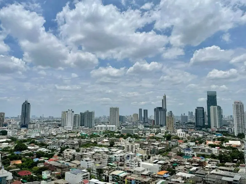 Stunning cityscape view showcasing a vibrant urban skyline under a picturesque sky.