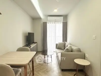 Modern living room with sleek furniture and natural light