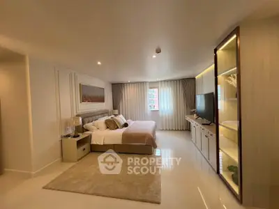 Luxurious bedroom with elegant decor, spacious layout, and natural light, perfect for comfort and relaxation.