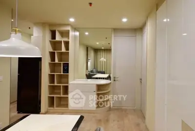 Modern interior with stylish shelving and sleek design in a cozy living space.