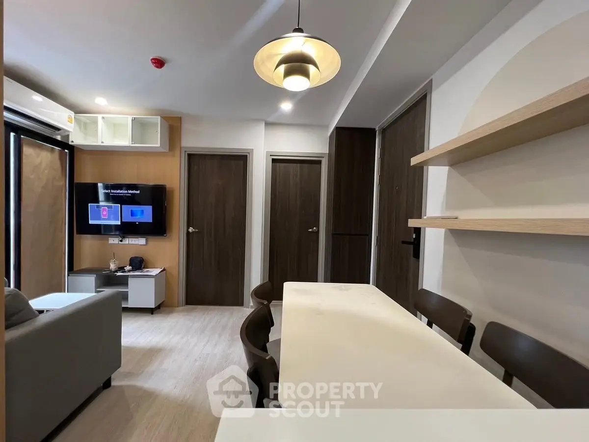 Modern living room with dining area and stylish lighting