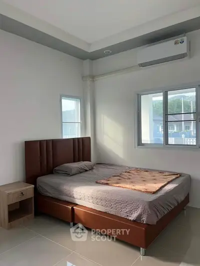 Modern bedroom with sleek design and natural light