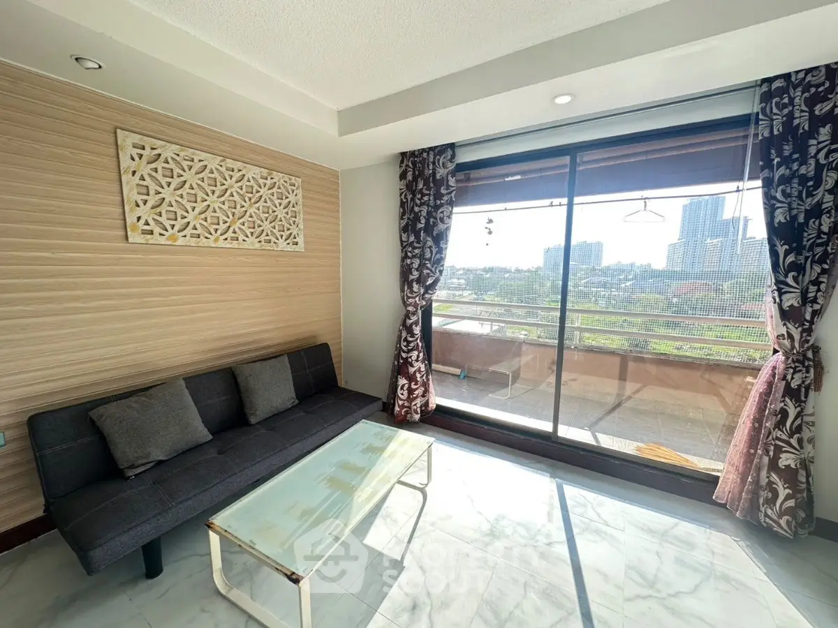 Bright living room with modern decor and city view balcony