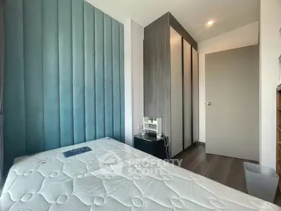 Modern bedroom with stylish paneling and sleek wardrobe design
