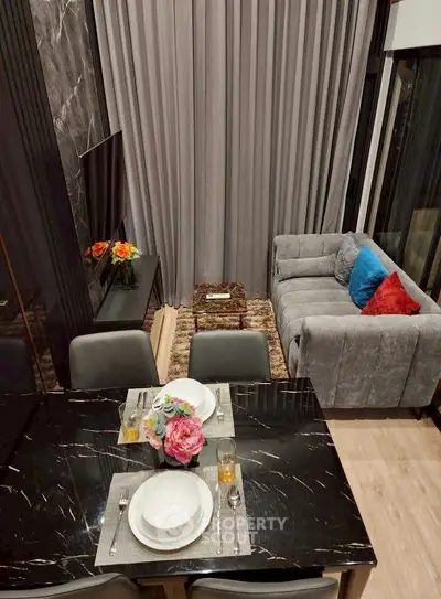 Luxurious modern living room with elegant dining area and plush seating