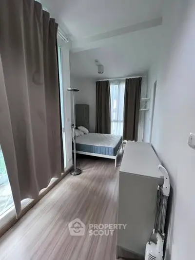 Modern bedroom with large windows and minimalist decor