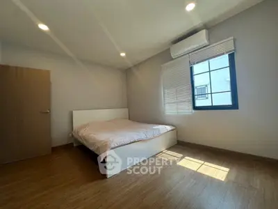 Spacious bedroom with modern design and natural light