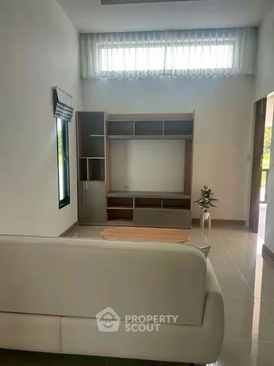 Modern living room with sleek furniture and natural light