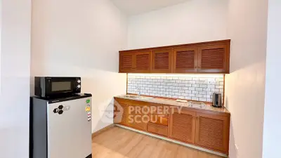 Modern kitchen with wooden cabinets and stainless steel appliances