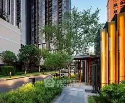 Modern building exterior with lush greenery and stylish entrance