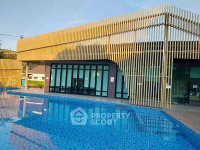 Modern poolside view with stylish architectural design and serene atmosphere.
