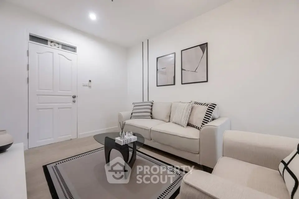 Modern living room with stylish decor and comfortable seating in a cozy apartment.