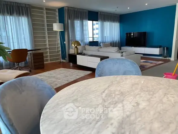 Spacious modern living room with elegant decor and large windows