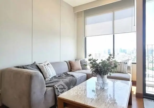 Chic living room with cozy sectional sofa and city view