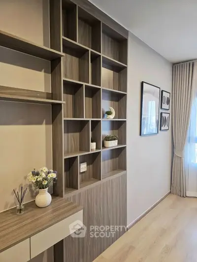Modern living room with stylish shelving and natural light