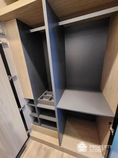 Spacious modern wardrobe with sleek design and ample storage space.