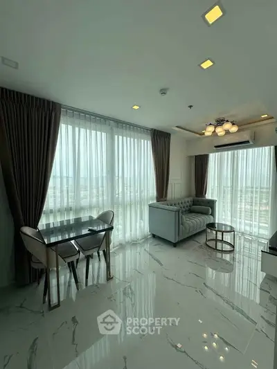 Luxurious living room with panoramic windows and elegant furnishings