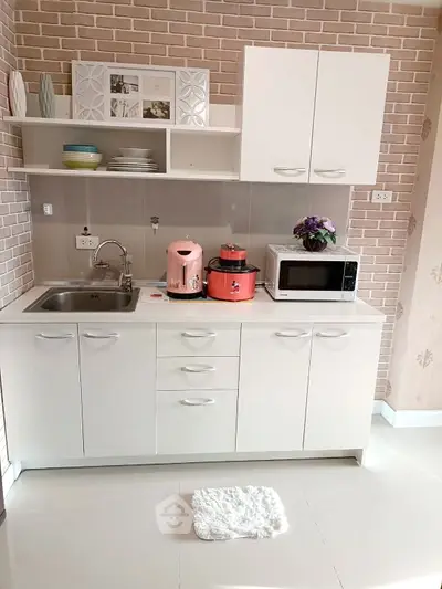 Modern kitchen with sleek white cabinets and open shelving