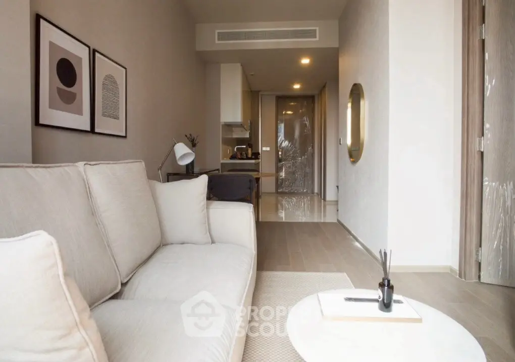 Modern living room with cozy sofa and stylish decor in a contemporary apartment.
