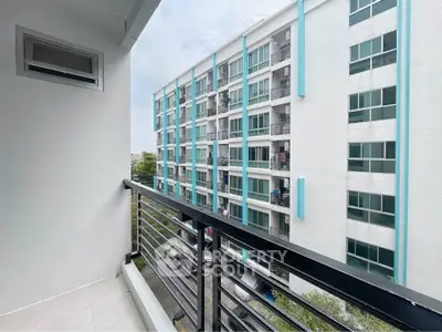 Modern apartment balcony with view of contemporary building exterior