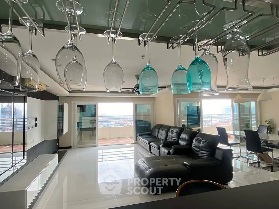 Luxurious modern living room with panoramic city views and elegant glass decor