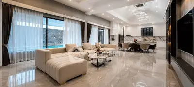 Luxurious open-plan living room with modern kitchen and elegant decor