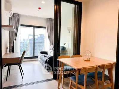 Modern apartment with open living and dining area, city view, and stylish furniture.
