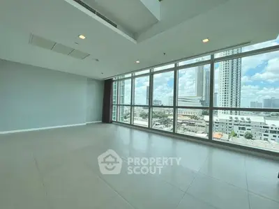 Spacious modern living room with panoramic city views and large windows