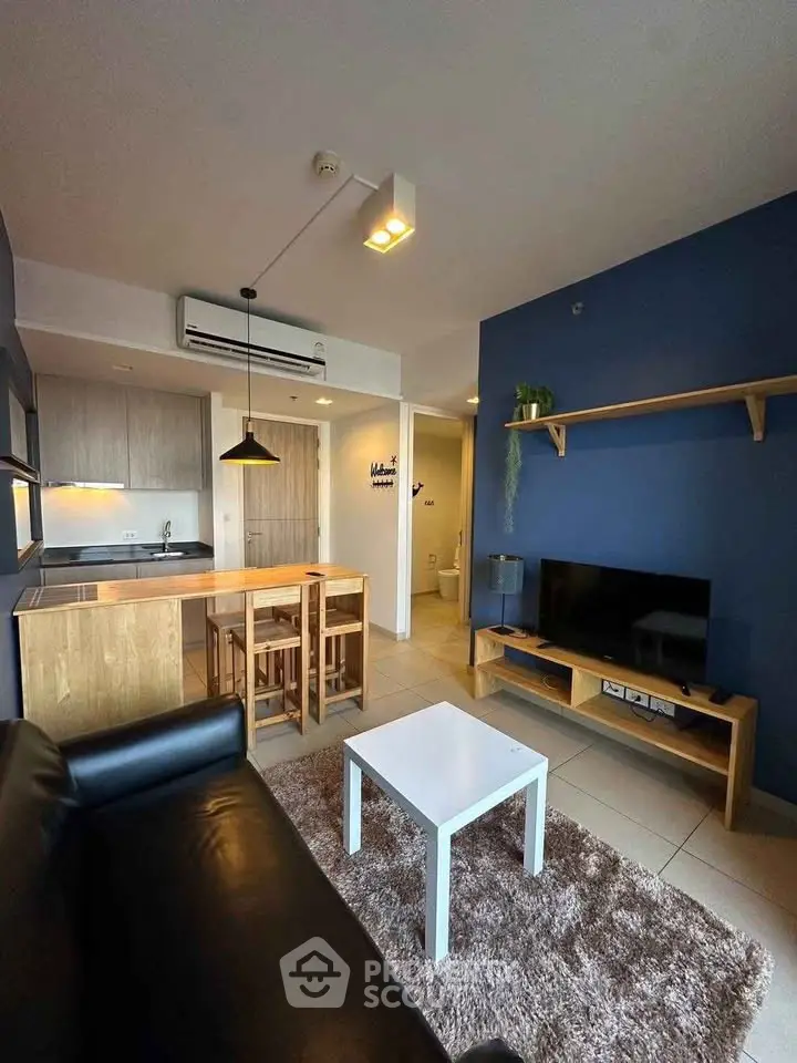 Modern living room with open kitchen and stylish decor