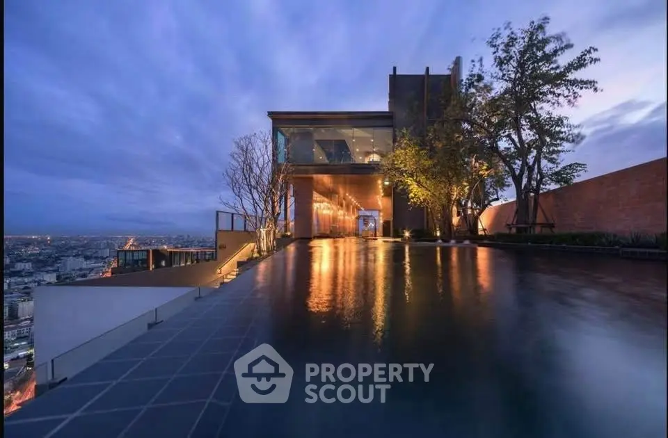 Stunning rooftop pool with breathtaking city views at twilight, perfect for luxury living.