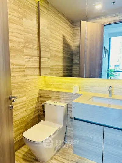 Modern bathroom with sleek fixtures and ambient lighting