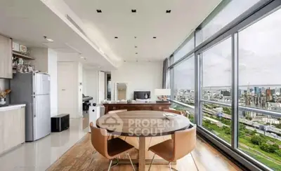 Stunning open-plan kitchen and dining area with panoramic city views