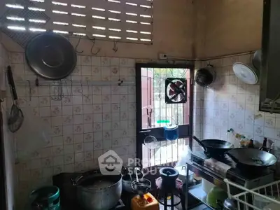 Cozy kitchen with traditional cooking setup and natural light