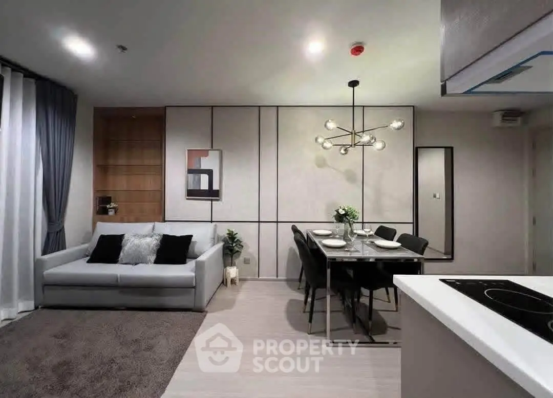 Modern living room with stylish dining area and contemporary lighting