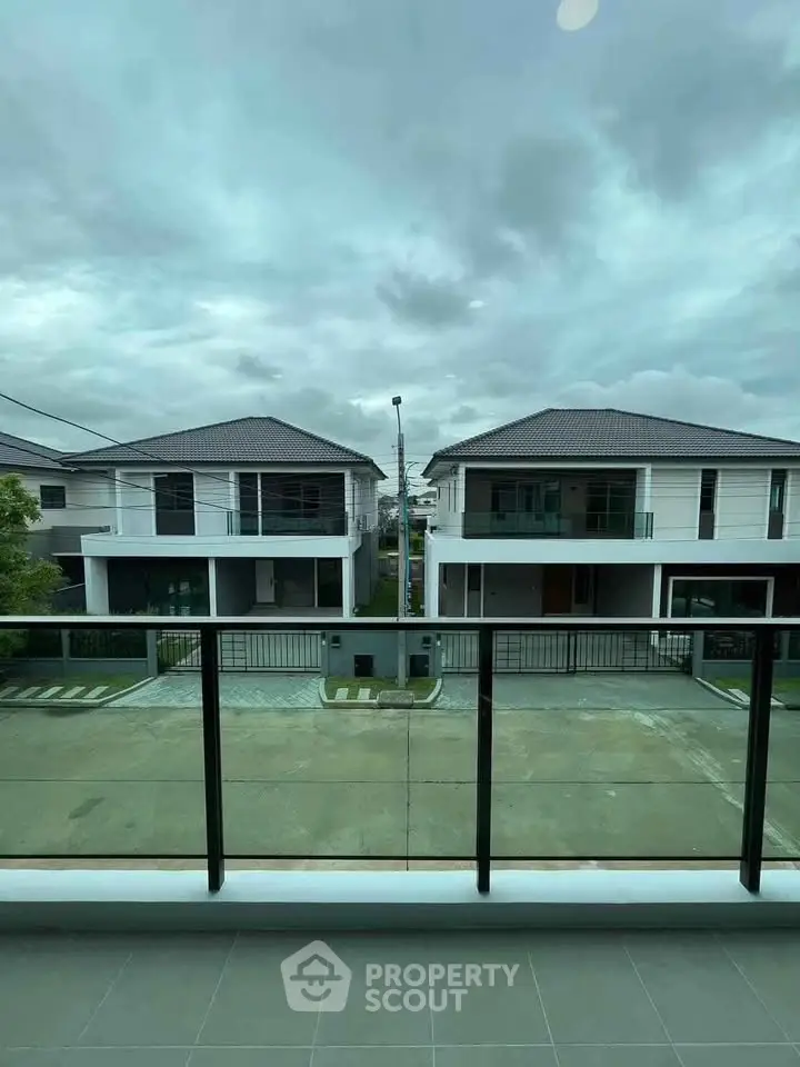 Modern residential neighborhood view from balcony with overcast sky