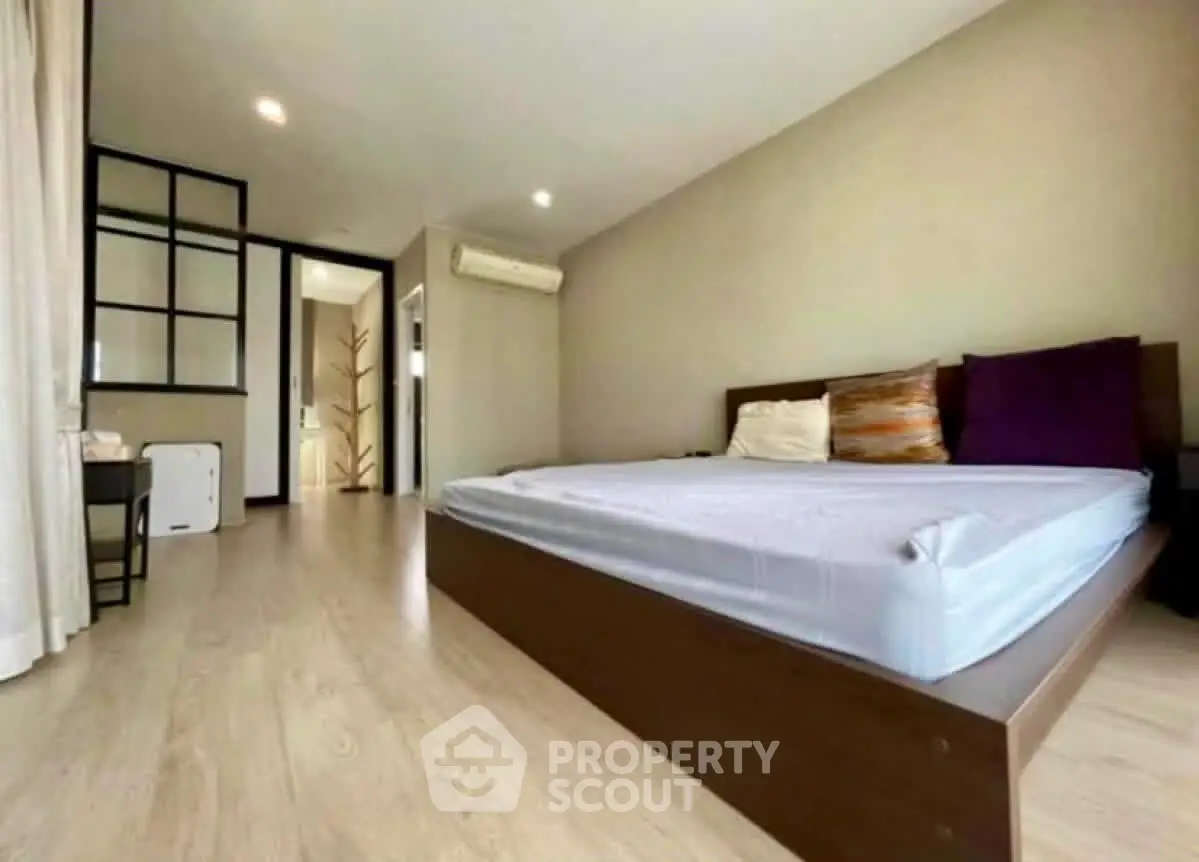 Spacious bedroom with modern design and natural light