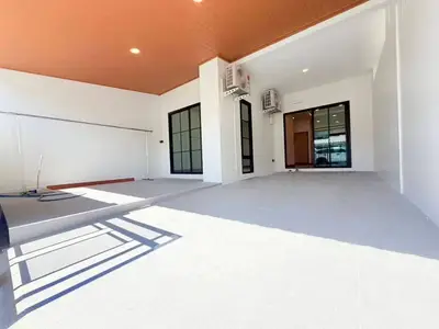 Spacious modern terrace with sleek design and ample natural light, perfect for outdoor relaxation.