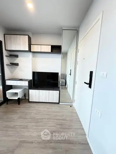 Modern living room with sleek furniture and stylish decor in a contemporary apartment.