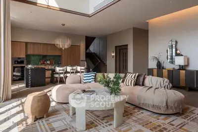 Luxurious open-plan living room with modern decor and natural light