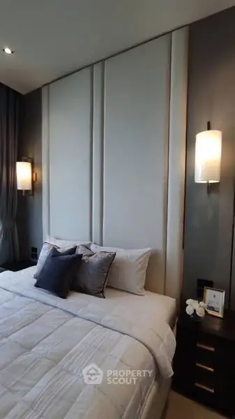 Luxurious modern bedroom with elegant lighting and plush bedding