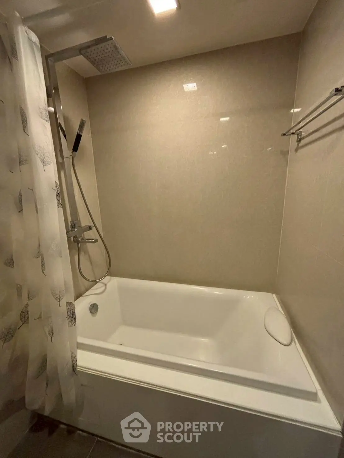 Modern bathroom with sleek bathtub and rainfall showerhead