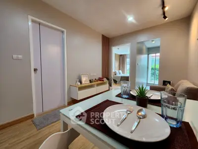 Modern living room with dining area and balcony view