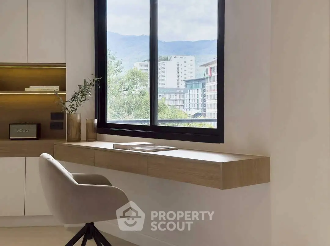 Modern study area with sleek desk and mountain view window