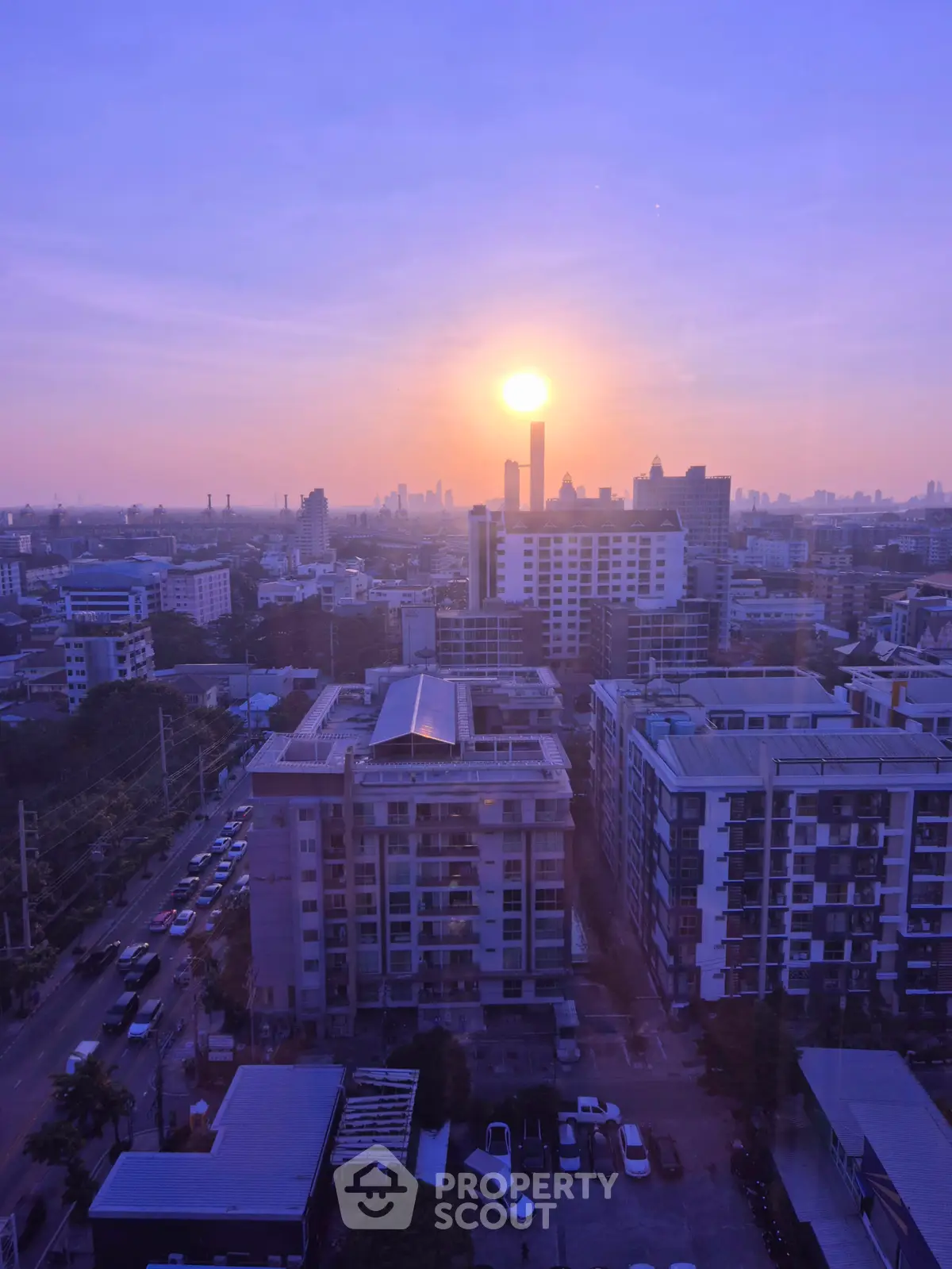 Stunning cityscape view at sunset with modern buildings and vibrant skyline.