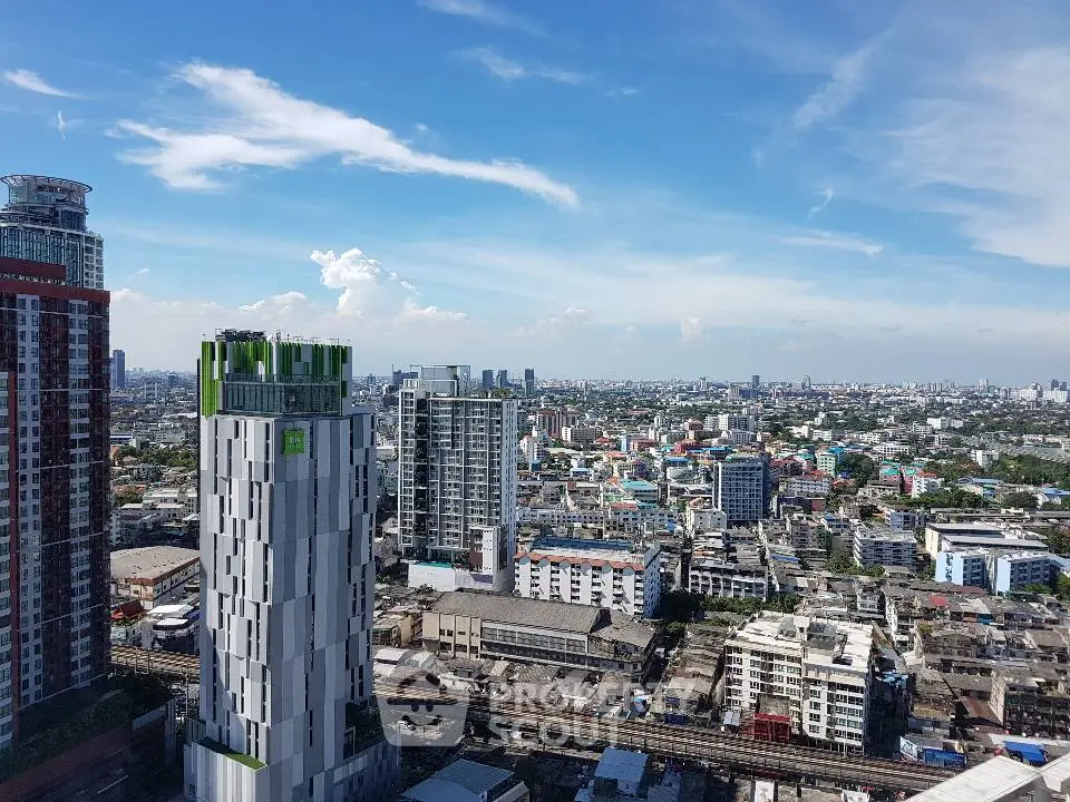Stunning cityscape view showcasing modern high-rise buildings under a clear blue sky.